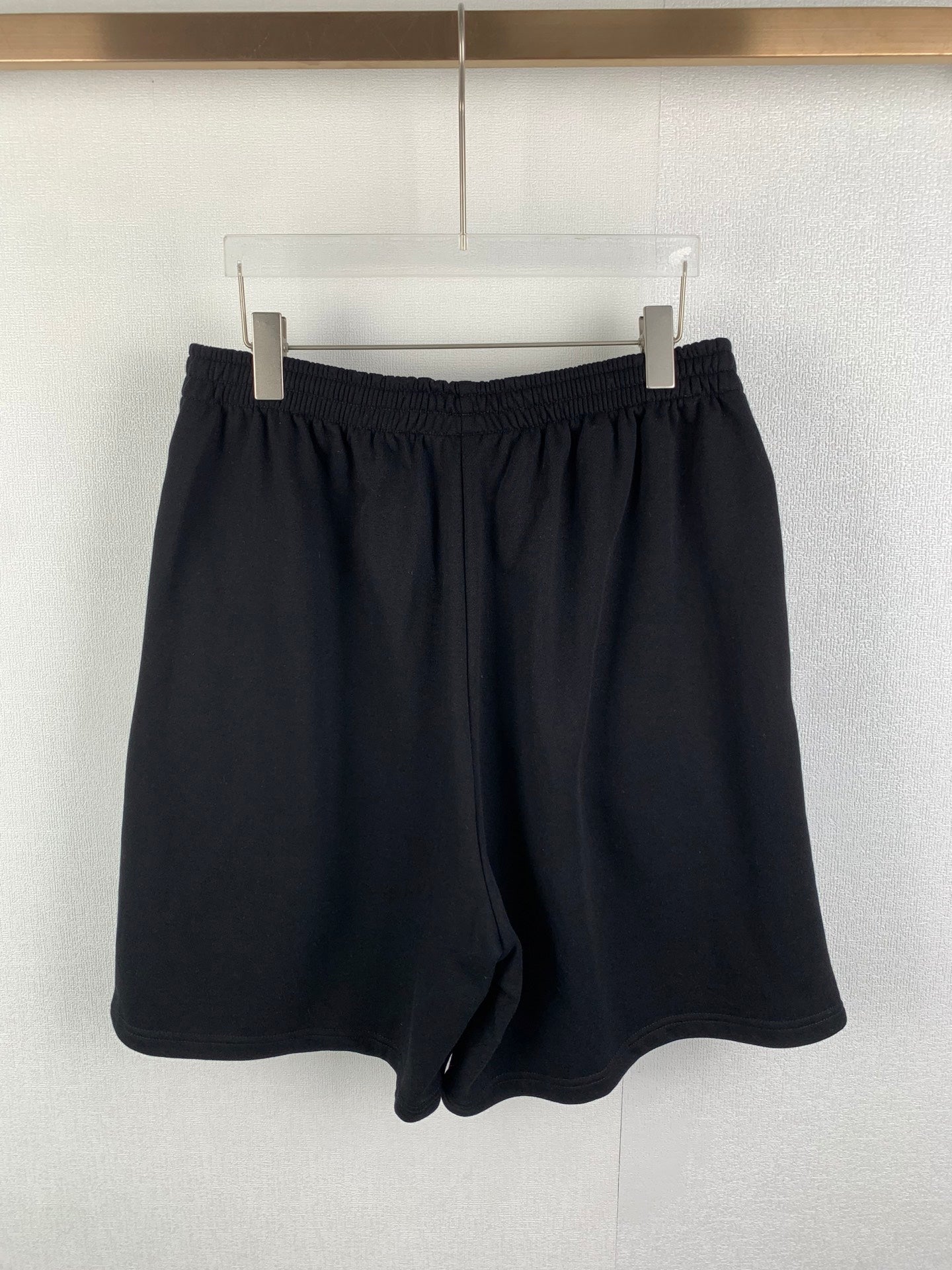 Dark knit shorts with elastic waistband and drawstring front