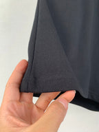 Dark knit shorts hem with stitched cuff and side seam