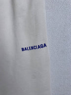 White fabric with blue BALENCIAGA wordmark print
