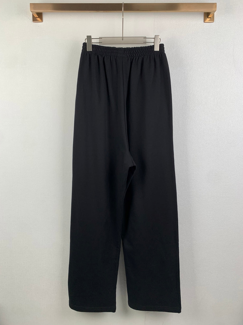 Balenciaga black wide-leg pants with elastic waist and side pockets