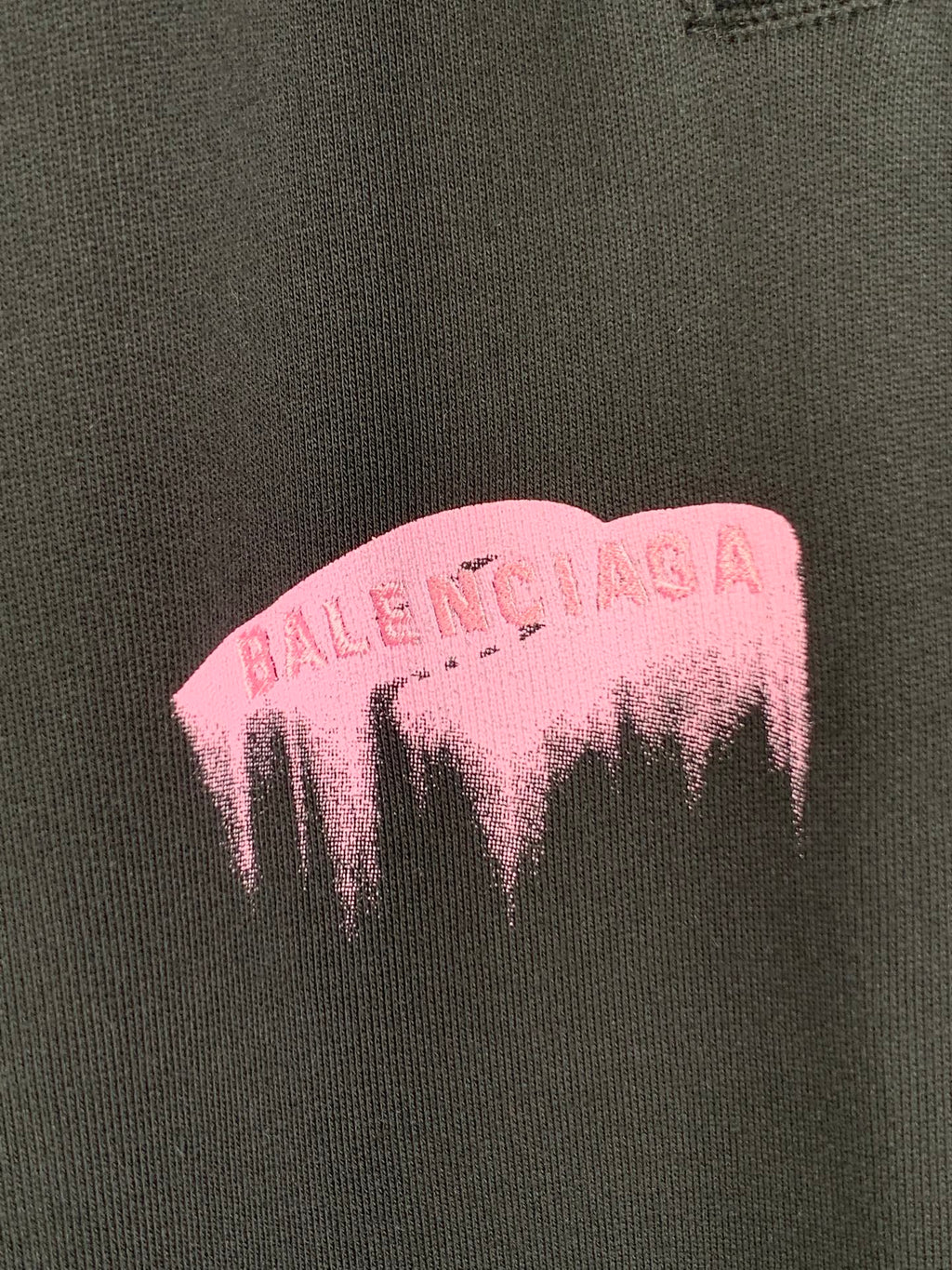 Balenciaga pink dripping logo print on dark fabric