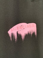 Balenciaga pink dripping logo print on dark fabric