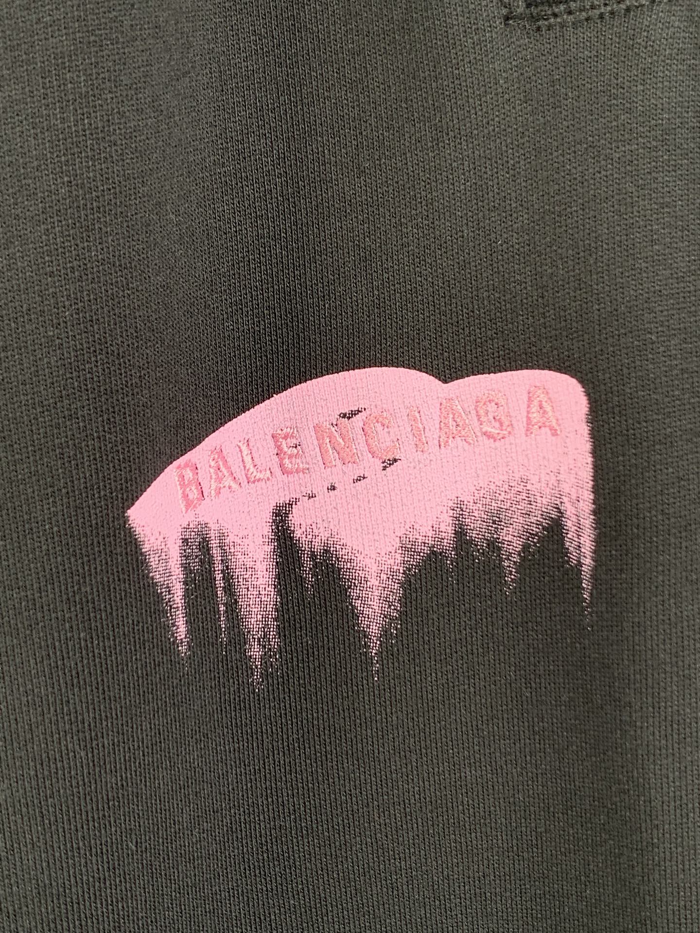 Balenciaga pink dripping logo print on dark fabric