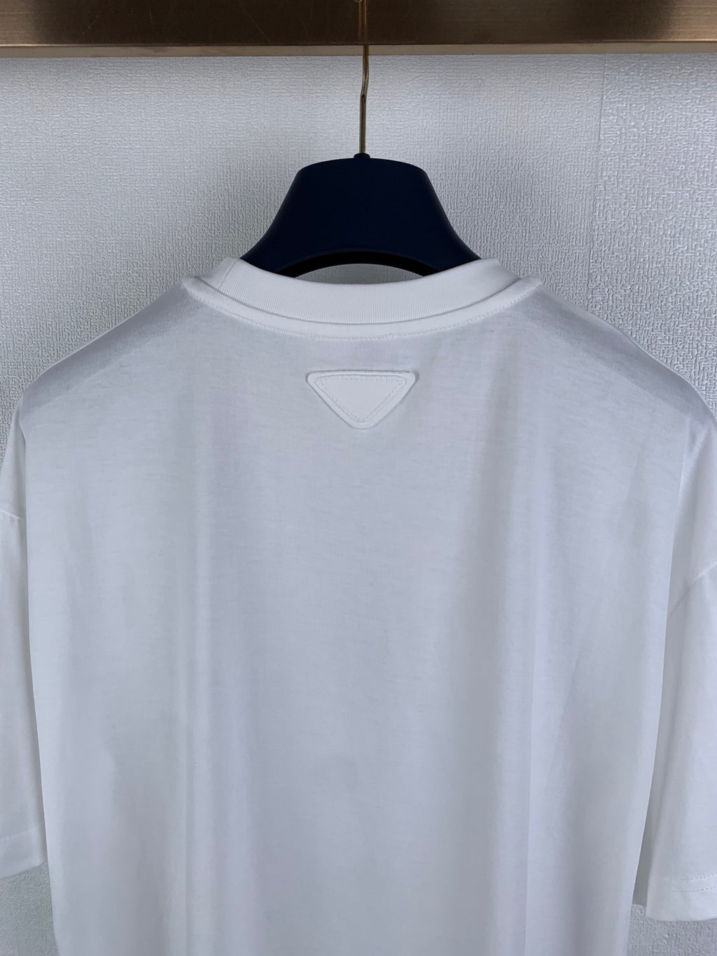 White crewneck T-shirt back with small triangular neckline detail