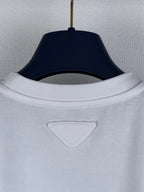 Prada short-sleeve top with ribbed crew neckline and triangular logo patch.