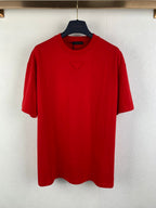 Red short-sleeve T-shirt on a hanger, crew neck, embroidered triangle logo at chest.