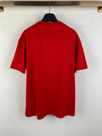 Red back view of short-sleeve T-shirt on a hanger.