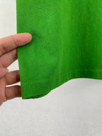 Prada short-sleeve T-shirt in bright green, close-up of stitched hem edge