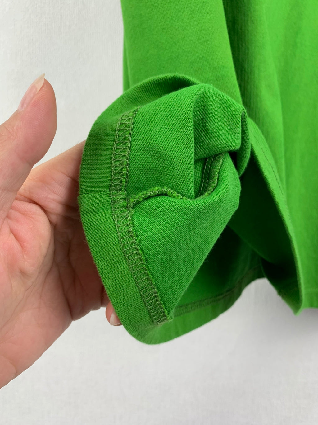 Prada short-sleeve T-shirt in bright green, sleeve cuff seam close-up