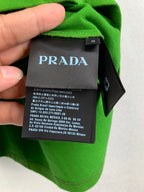 Prada care label tag on bright green short-sleeve T-shirt