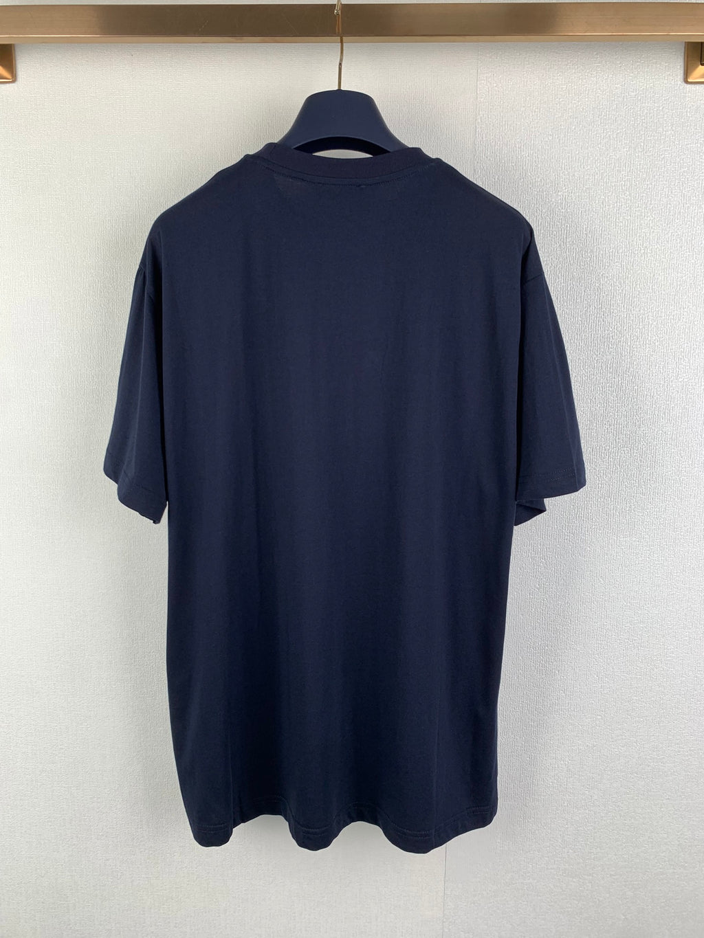 Navy Prada crewneck T-shirt back view on hanger