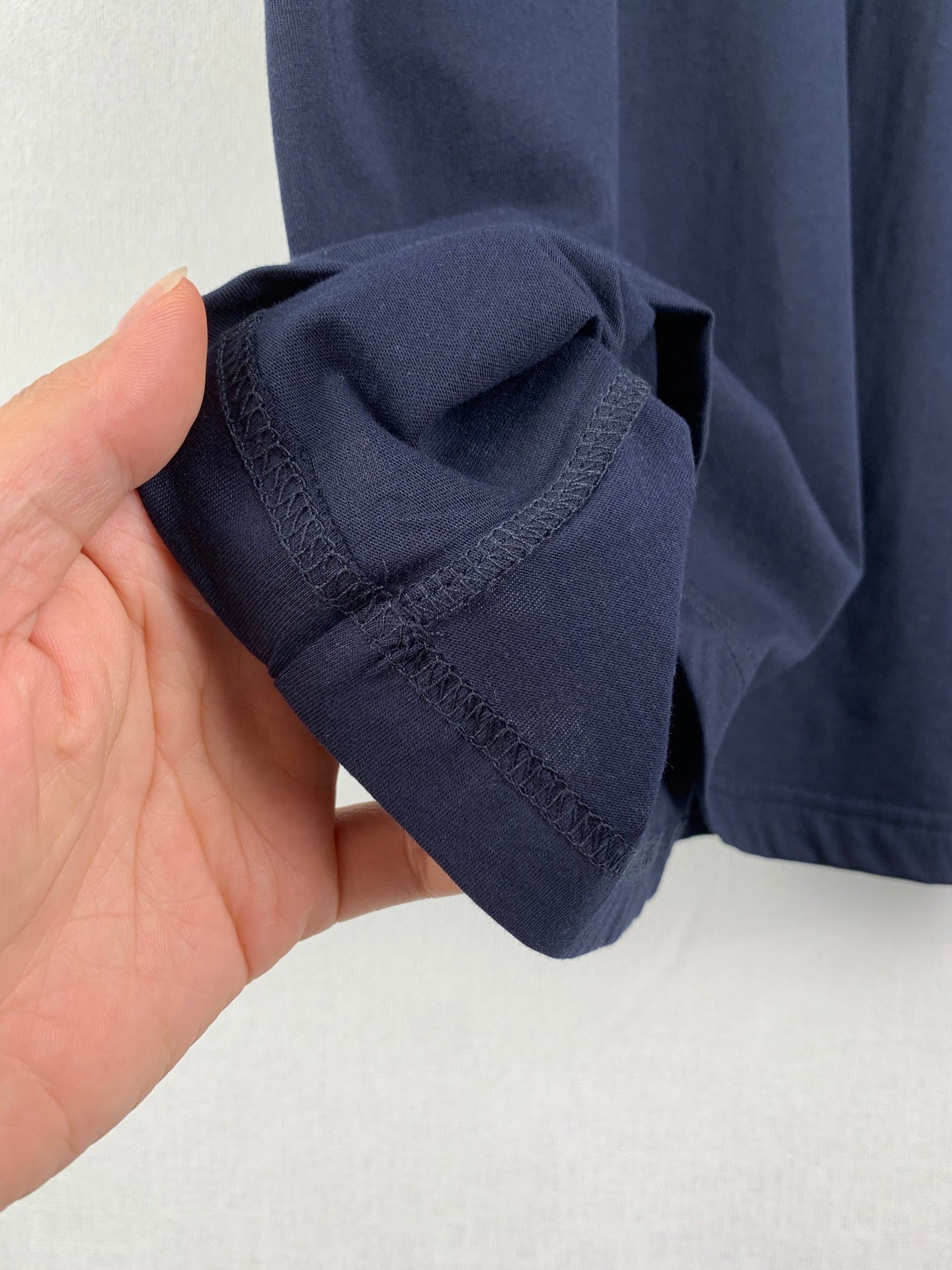 Navy Prada T-shirt sleeve cuff and stitching detail
