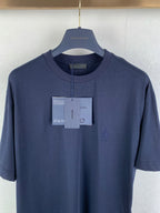 Navy Prada crewneck T-shirt close-up on chest with hang tags