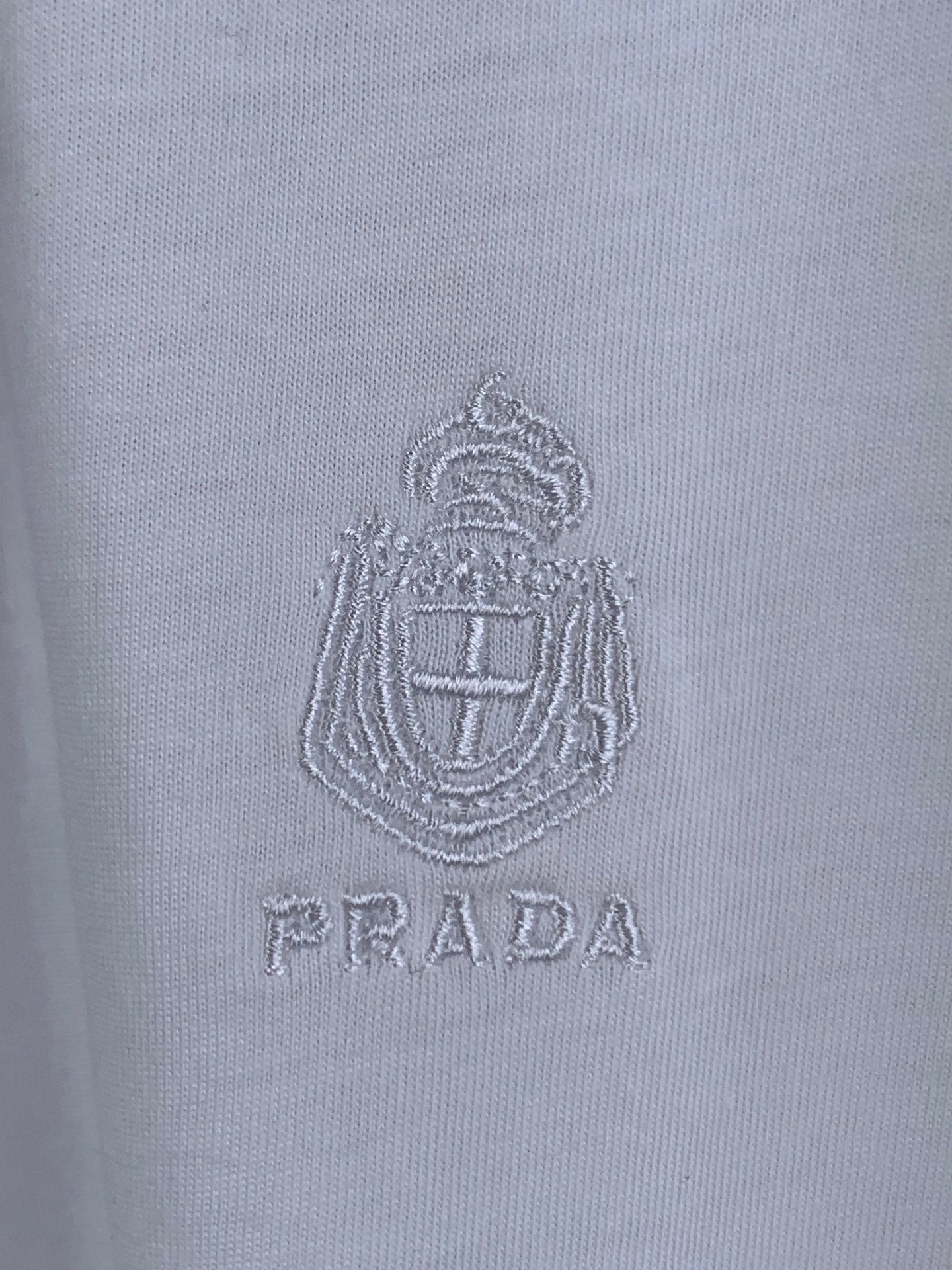 White T-shirt with embroidered PRADA crest logo