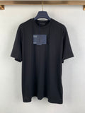 Prada short-sleeve crewneck T-shirt in dark fabric with attached tags
