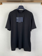 Prada short-sleeve crewneck T-shirt in dark fabric with attached tags