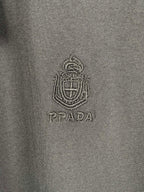 Prada T-shirt logo crest and PRADA text on dark fabric