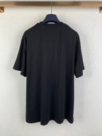 Prada crewneck T-shirt in dark fabric, back view on hanger