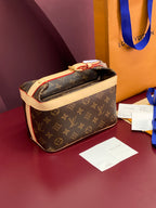 Louis Vuitton monogram bag in brown with cream trim, zip-top and gold hardware