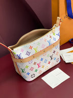 Louis Vuitton mini handbag open view with tan interior lining and gold zipper pull