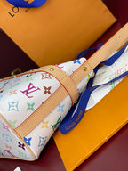 Louis Vuitton mini handbag with multicolor monogram print and tan leather trim