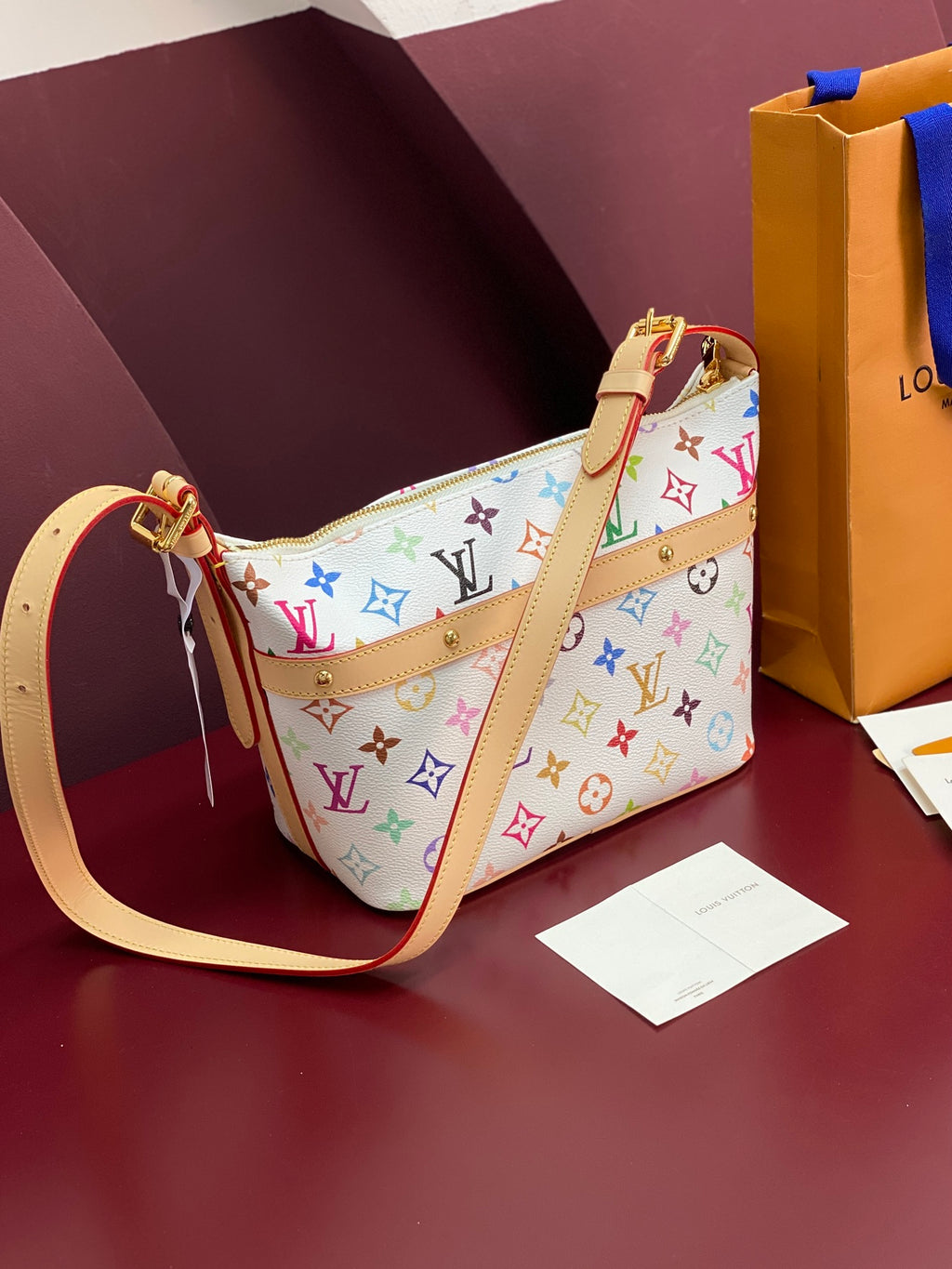 Louis Vuitton multicolor monogram shoulder bag with tan top handle and strap