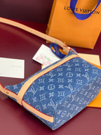 Louis Vuitton blue monogram top view bag with tan trim and gold zipper pull