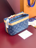 Louis Vuitton bag in blue monogram canvas with tan leather trim and top zipper