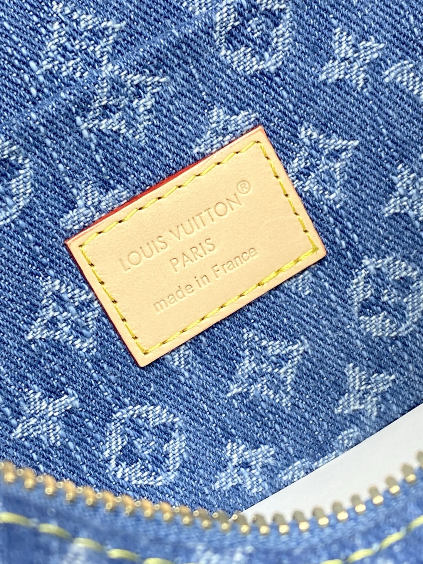 Louis Vuitton blue monogram fabric patch with yellow border and brand text