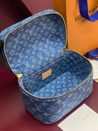 Louis Vuitton blue monogram vanity bag open, shows tan label and interior lining