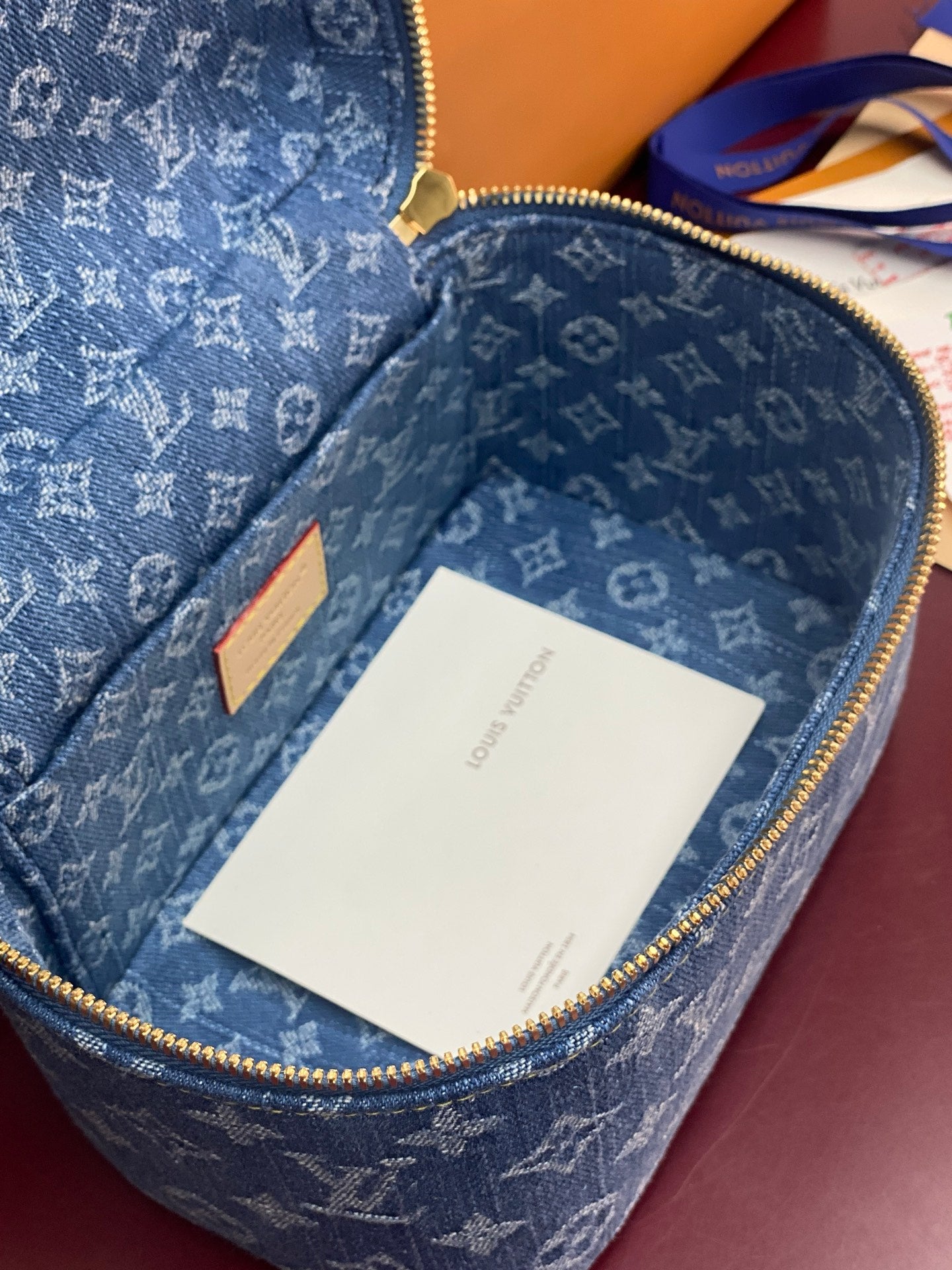 Louis Vuitton blue monogram vanity bag open, interior with white tag card