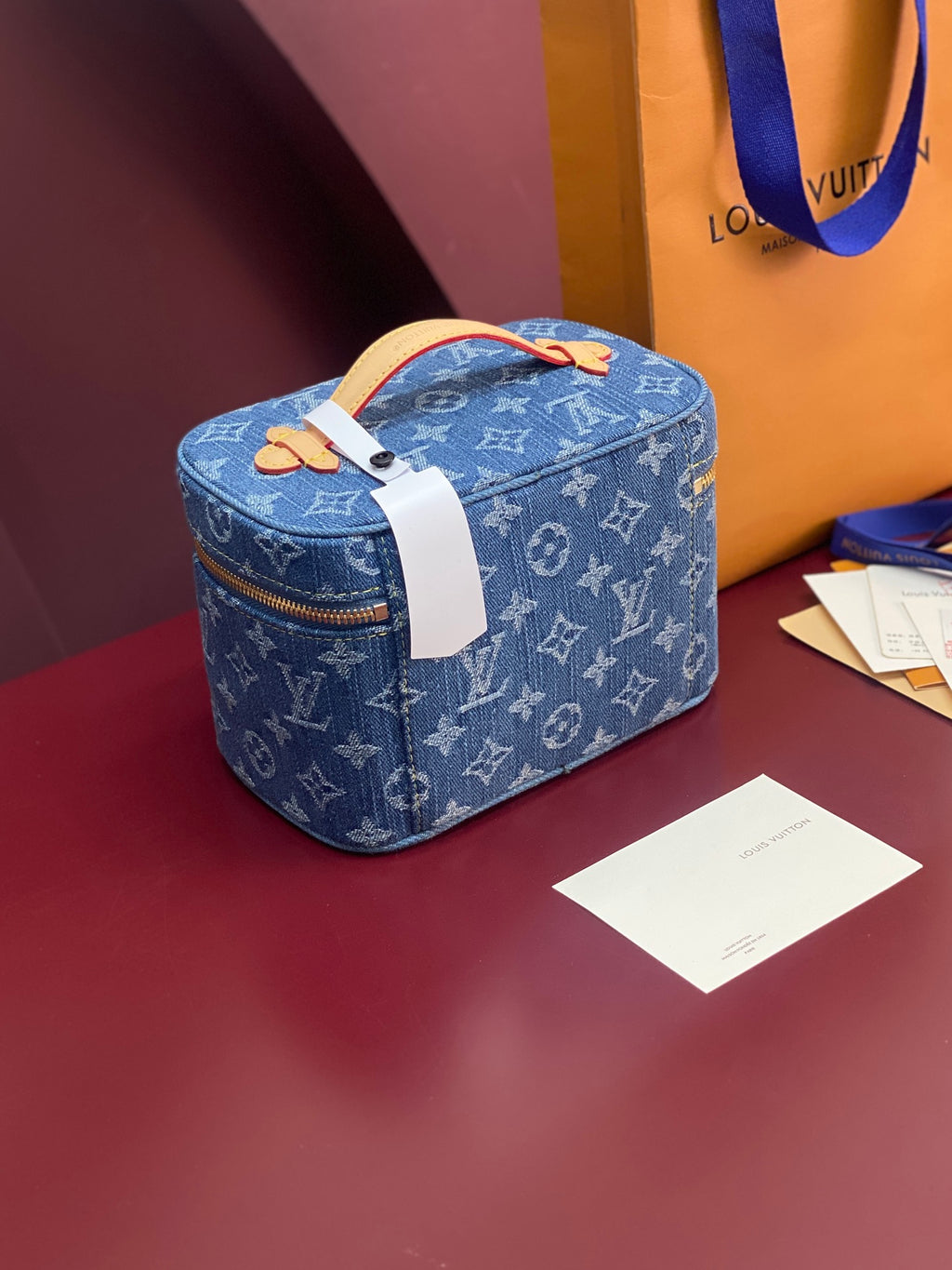 Louis Vuitton blue monogram mini vanity bag with white strap and gold zipper