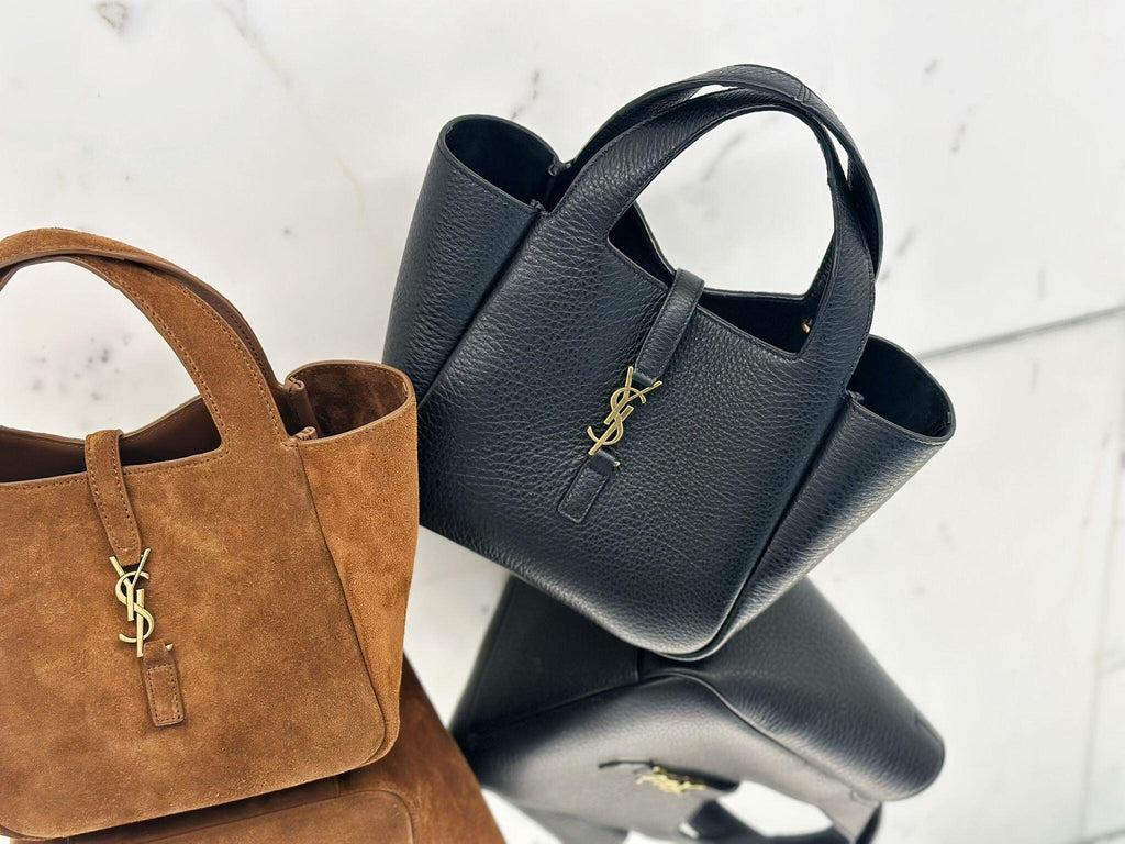 YSL textured leather tote bag in dark blue with top handles and gold YSL logo