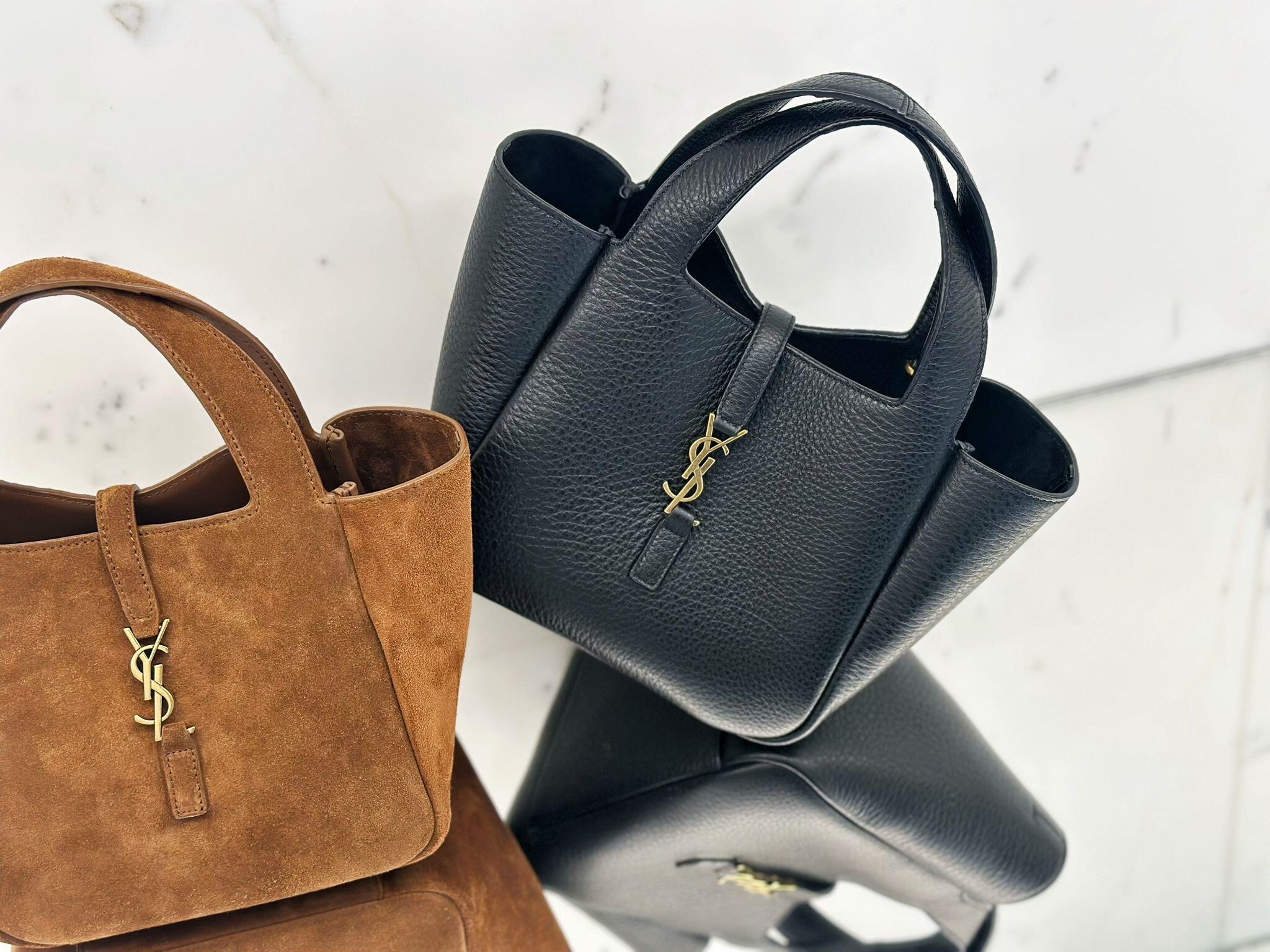 YSL textured leather tote bag in dark blue with top handles and gold YSL logo