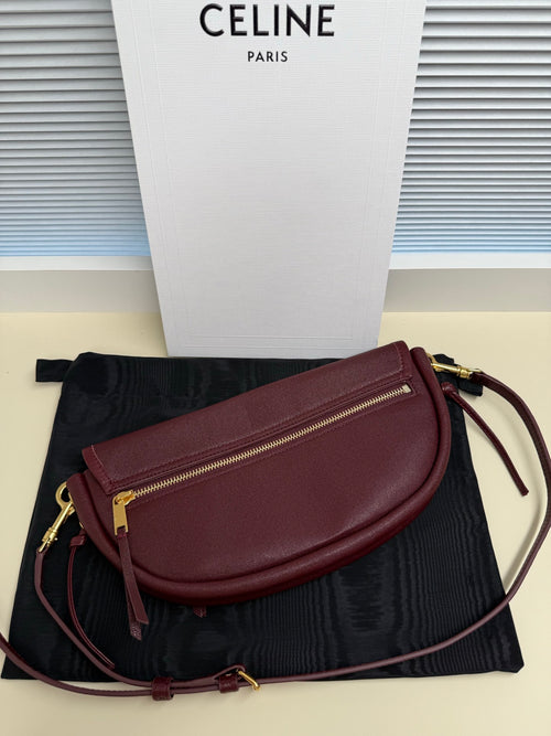 Celine crossbody bag, burgundy flap with gold zipper pocket and strap