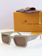 Louis Vuitton sunglasses with light beige square frames and brown-tinted lenses, LV logo.