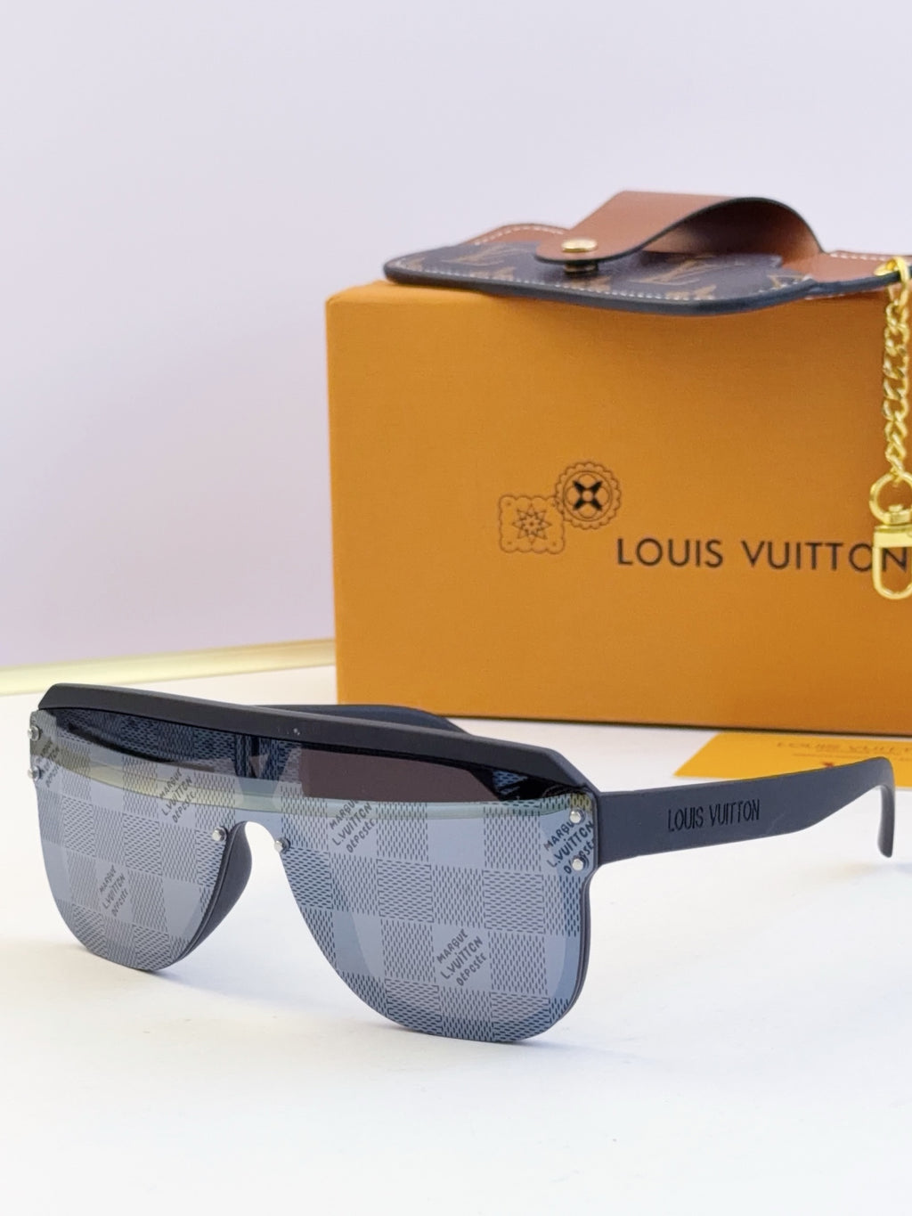 Light blue patterned sunglasses with dark frame and tinted lenses