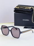 Chanel dark blue square sunglasses with purple-tinted lenses and gold chain detail