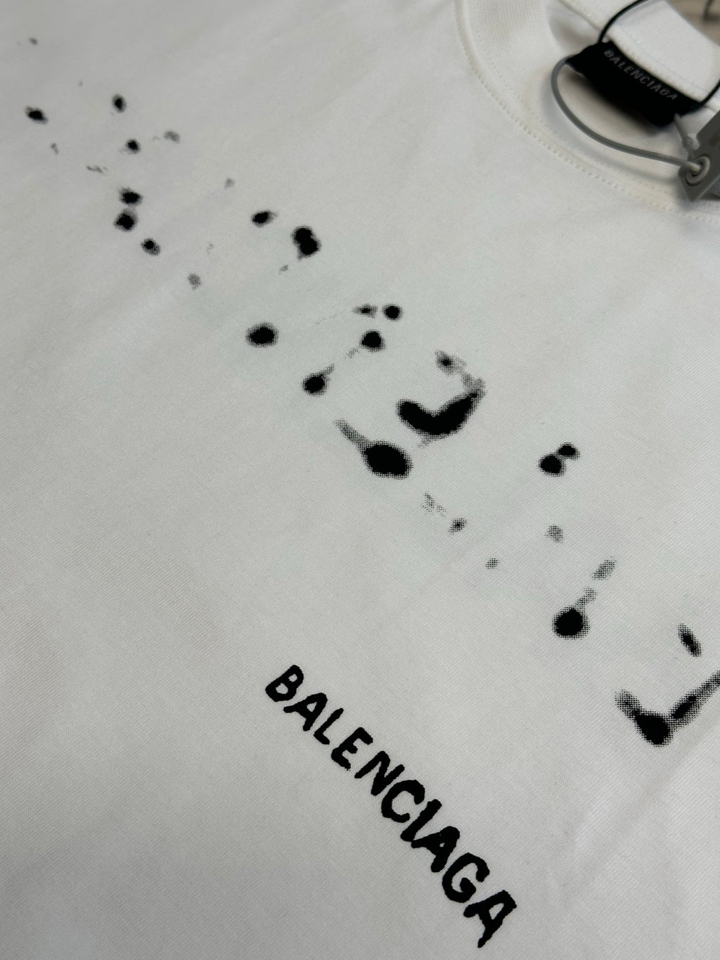 Balenciaga T-shirt in white with black splatter dots and BALENCIAGA text