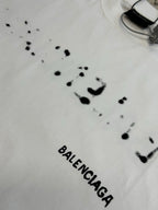 Balenciaga T-shirt in white with black splatter dots and BALENCIAGA text