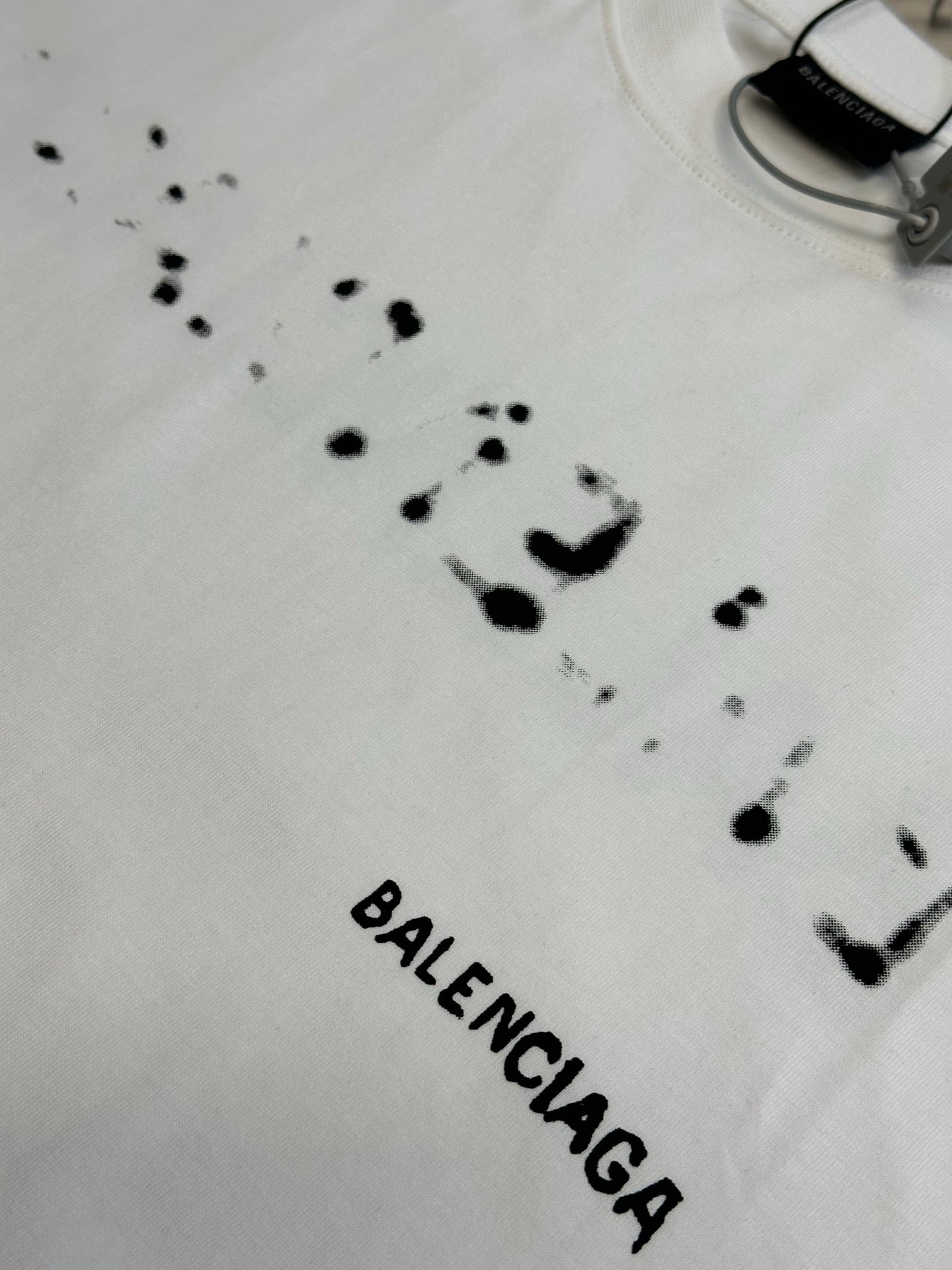 Balenciaga T-shirt in white with black splatter dots and BALENCIAGA text