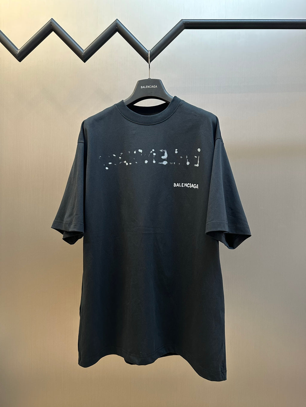 Balenciaga short-sleeve T-shirt in dark gray with splatter graphic and crew neck.