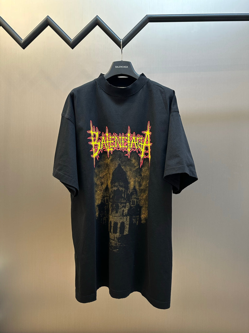 Black T-shirt with neon graphic front, short sleeves and crew neck
