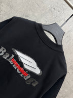 Black crewneck T-shirt close-up of large back logo graphic