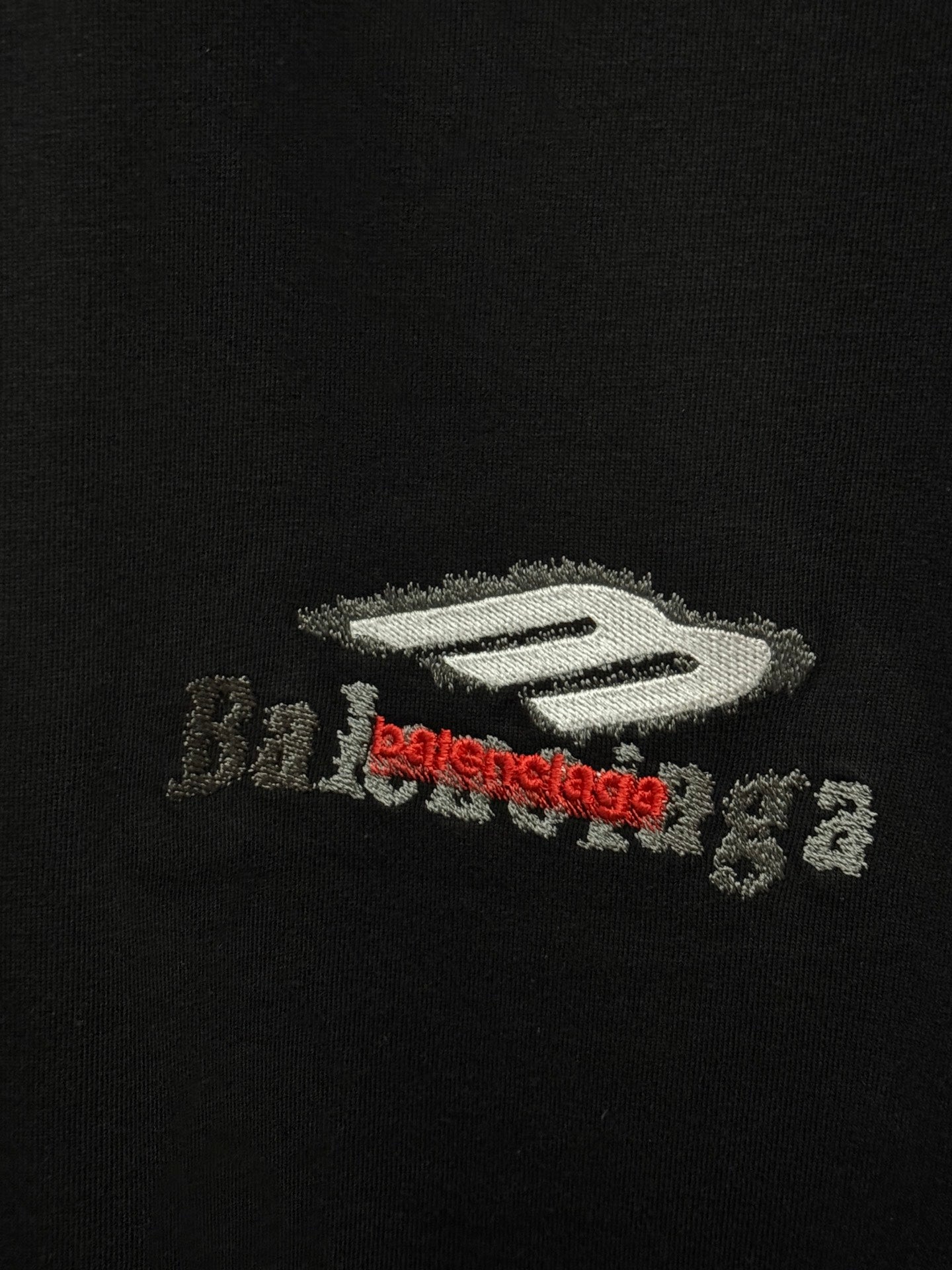 Black T-shirt with Balenciaga logo graphic in white and red