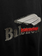 Black T-shirt close-up with Balenciaga logo graphic in white and red