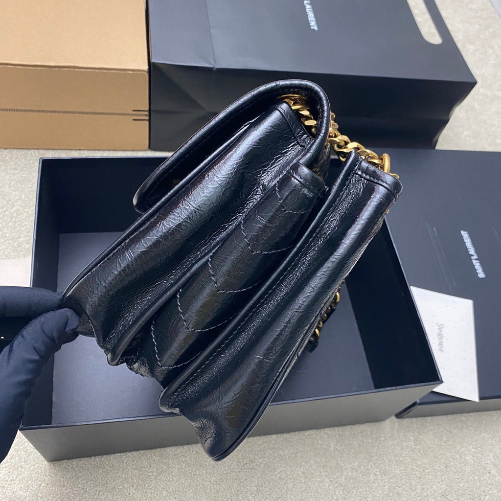 YSL leather shoulder bag, dark blue, side view with gold chain strap and hardware