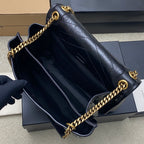 YSL leather shoulder bag interior view, dark blue lining with gold chain trim