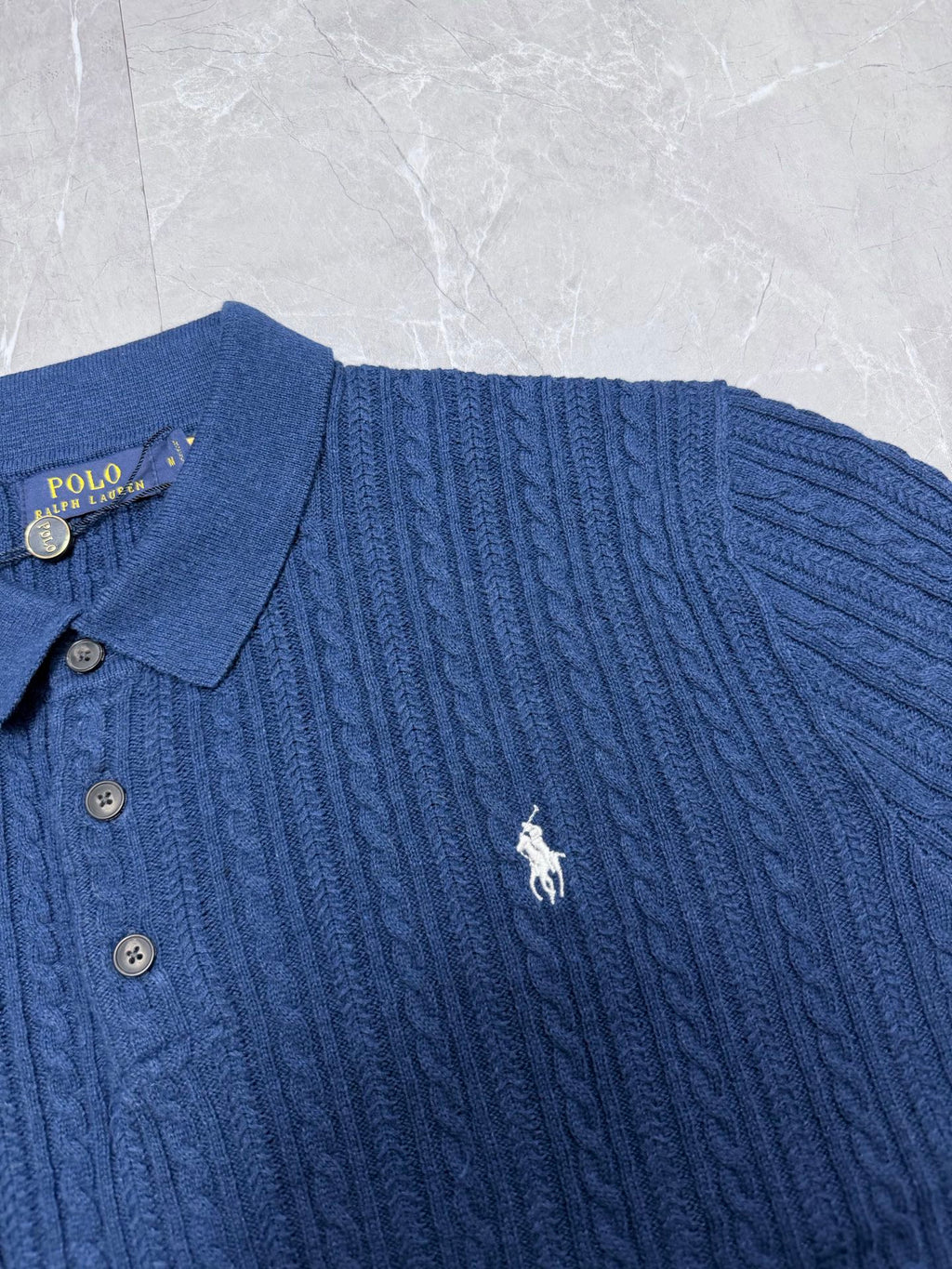 Ralph Lauren cable-knit polo shirt in blue with buttoned collar and small horse logo