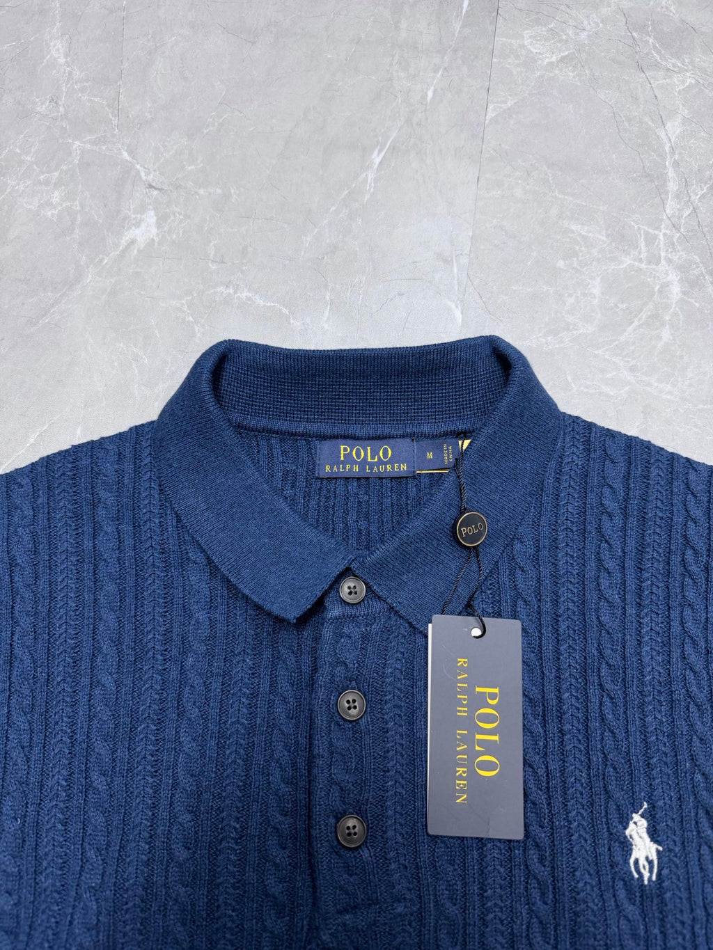 Ralph Lauren polo knit shirt in blue with buttons, collar, and horse logo